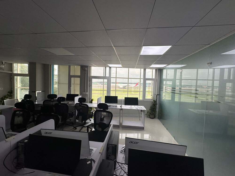 Classroom desks facing the airfield