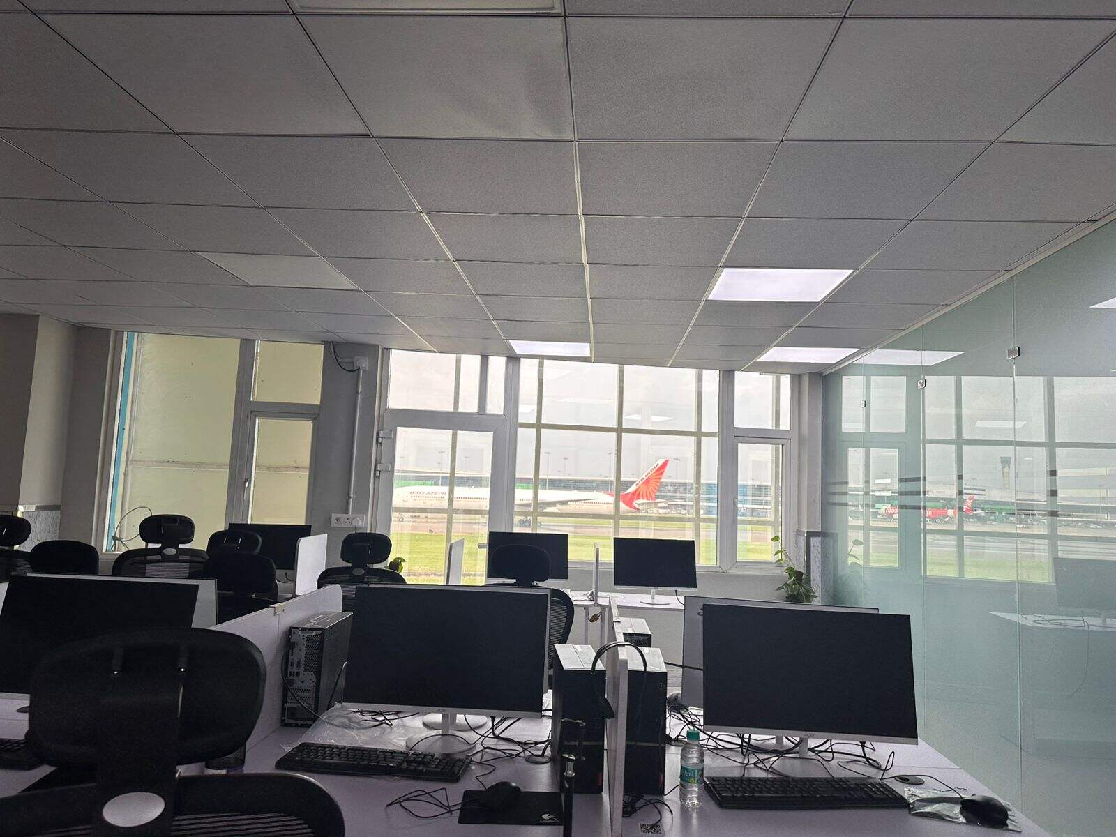 Classroom at the Airline Training Centre with an aircraft on the airfield outside
